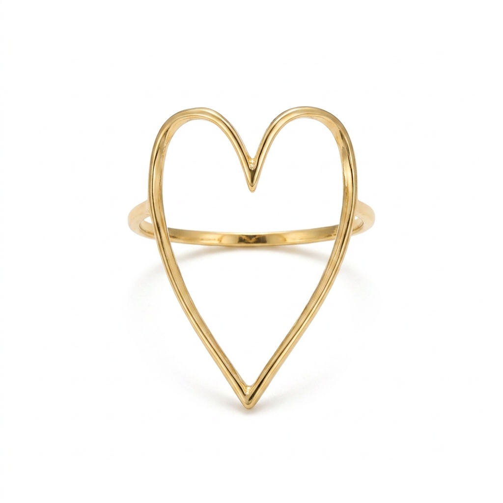 The clean cutout: a gold heart cut-out ring on seamless white, soft even light, one faint shadow
